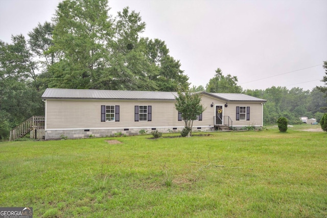 4040 US Highway 25 N, Hephzibah, GA 30815 - manufactured / mobile home with crawl space, entry steps, a front yard, and metal roof
