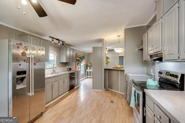 4040 US Highway 25 N, Hephzibah, GA 30815 - kitchen with appliances with stainless steel finishes, a ceiling fan, a sink, light countertops, and ornamental molding
