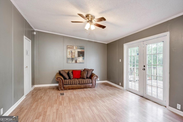 4040 US Highway 25 N, Hephzibah, GA 30815 - sitting room featuring crown molding, french doors, wood finished floors, ceiling fan, and a textured ceiling