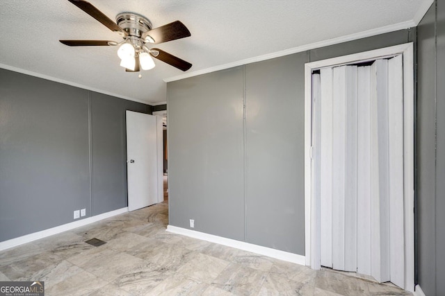 4040 US Highway 25 N, Hephzibah, GA 30815 - unfurnished bedroom featuring ornamental molding, a ceiling fan, baseboards, and a textured ceiling