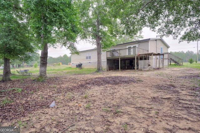 4040 US Highway 25 N, Hephzibah, GA 30815 - back of house featuring a wooden deck