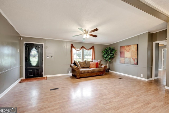 4040 US Highway 25 N, Hephzibah, GA 30815 - entrance foyer with crown molding, ceiling fan, light wood-type flooring, baseboards, and a textured ceiling