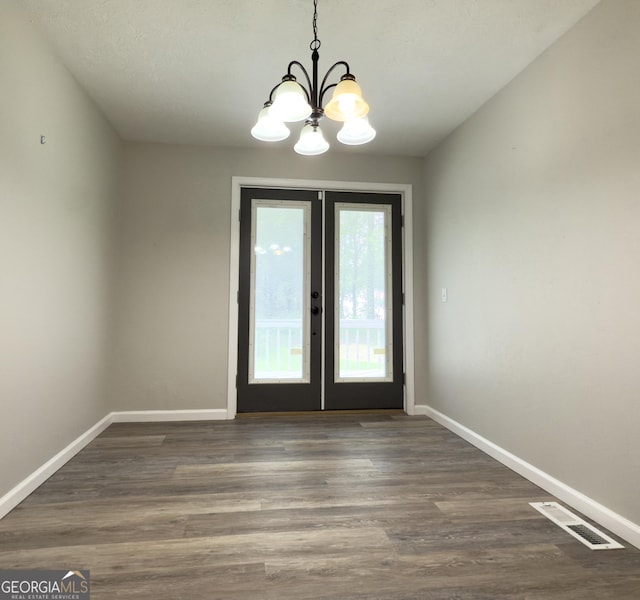 253 Yonah Valley Rd, Cleveland, GA 30528 - unfurnished dining area with a chandelier, baseboards, french doors, and dark wood-style floors