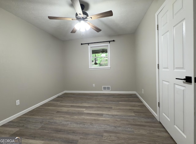 253 Yonah Valley Rd, Cleveland, GA 30528 - unfurnished room with baseboards, a ceiling fan, dark wood-style floors, and a textured ceiling