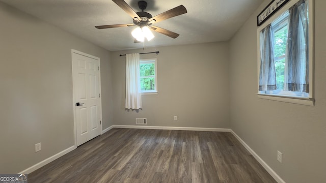 253 Yonah Valley Rd, Cleveland, GA 30528 - unfurnished room featuring baseboards, dark wood finished floors, and ceiling fan