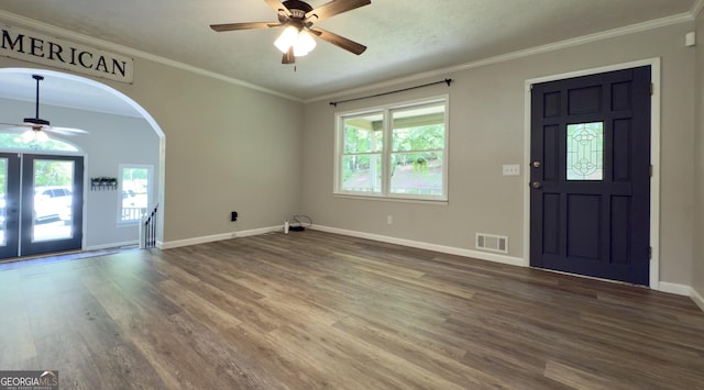 253 Yonah Valley Rd, Cleveland, GA 30528 - entryway featuring ceiling fan, wood finished floors, baseboards, crown molding, and arched walkways