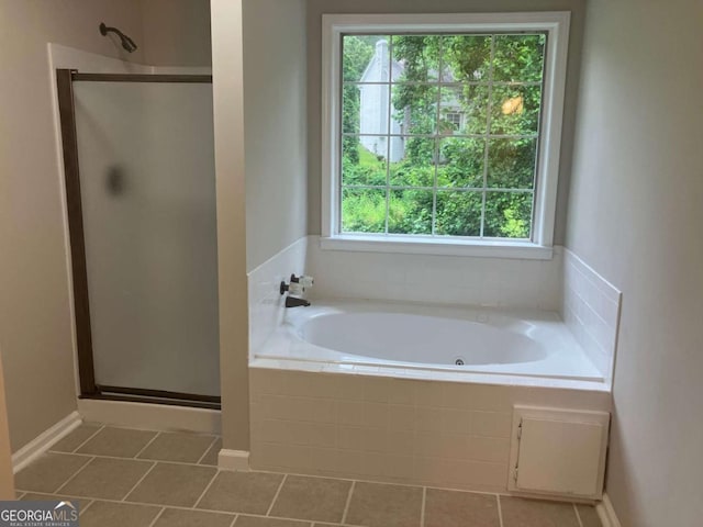 7593 Watson Bay Ct, Stone Mountain, GA 30087 - bathroom with a shower stall, plenty of natural light, a tub with jets, and tile patterned floors
