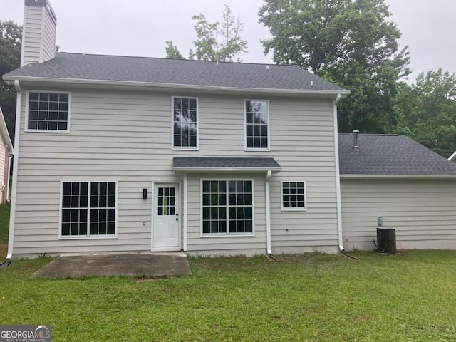 7593 Watson Bay Ct, Stone Mountain, GA 30087 - back of house with a patio area, a lawn, a chimney, and a shingled roof