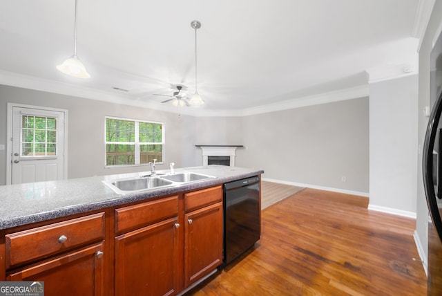 5057 Lower Elm St, Atlanta, GA 30349 - kitchen featuring black appliances, a sink, a ceiling fan, ornamental molding, and a fireplace