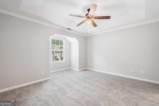 5057 Lower Elm St, Atlanta, GA 30349 - unfurnished room featuring carpet floors, a ceiling fan, ornamental molding, baseboards, and a raised ceiling