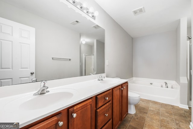 5057 Lower Elm St, Atlanta, GA 30349 - full bathroom with a stall shower, a garden tub, toilet, and double vanity