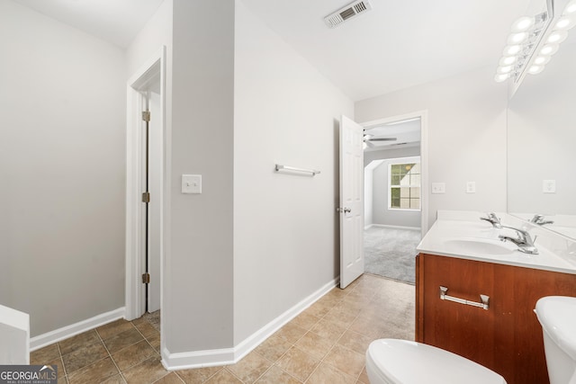5057 Lower Elm St, Atlanta, GA 30349 - bathroom with toilet, double vanity, and baseboards