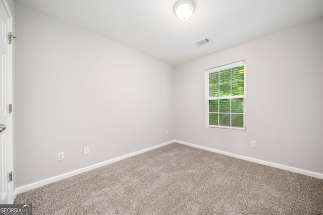 5057 Lower Elm St, Atlanta, GA 30349 - carpeted spare room featuring baseboards