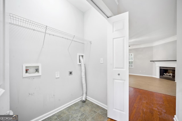 5057 Lower Elm St, Atlanta, GA 30349 - washroom featuring hookup for an electric dryer, washer hookup, baseboards, a fireplace, and crown molding