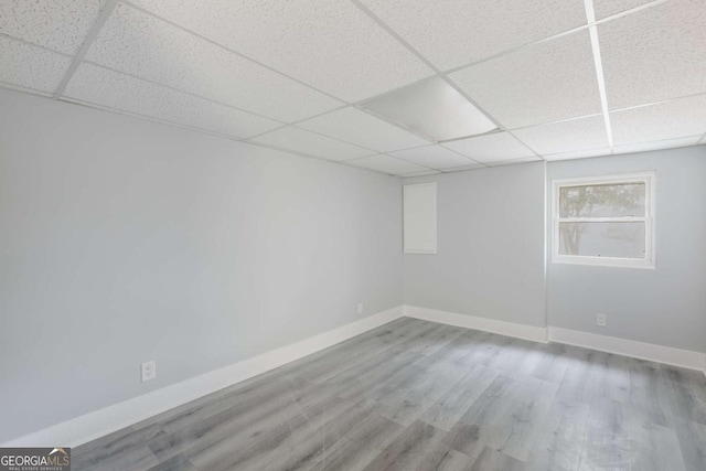 1506 Vine St NE, Gainesville, GA 30501 - unfurnished room featuring a drop ceiling, baseboards, and wood finished floors
