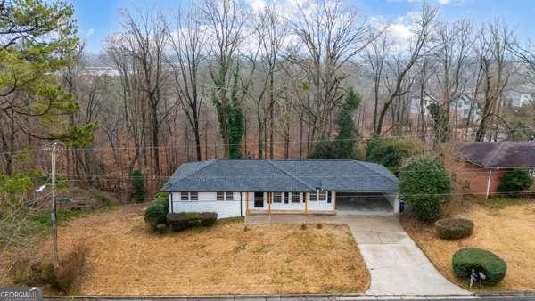 1506 Vine St NE, Gainesville, GA 30501 - single story home featuring driveway and a carport