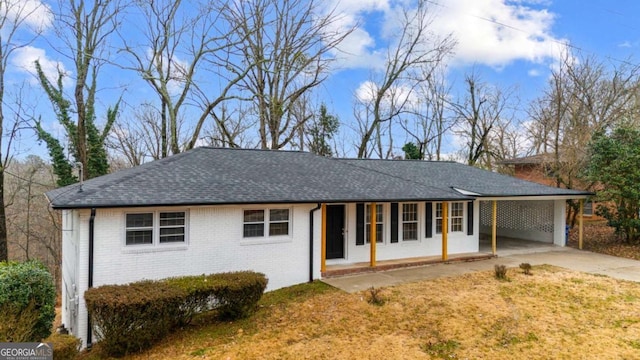 1506 Vine St NE, Gainesville, GA 30501 - ranch-style house with concrete driveway, brick siding, roof with shingles, and an attached carport