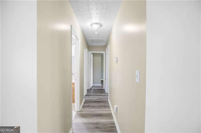 5422 Timor Trl, Lithonia, GA 30038 - hall with a textured ceiling, baseboards, and light wood finished floors