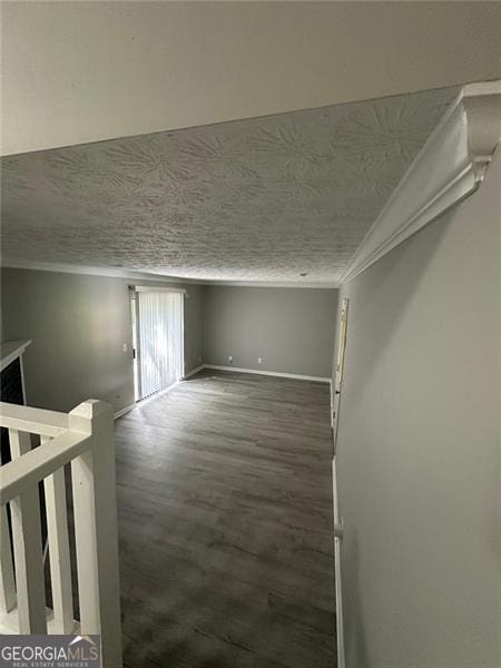 5388 Robertson Path, Lithonia, GA 30038 - spare room featuring ornamental molding, wood finished floors, a textured ceiling, and baseboards