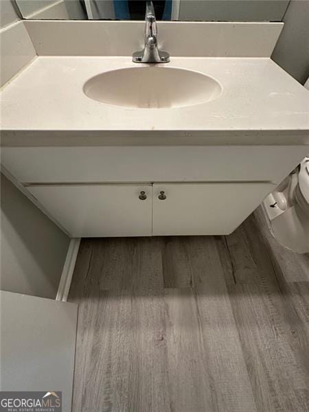 5388 Robertson Path, Lithonia, GA 30038 - bathroom featuring vanity, wood finished floors, and toilet