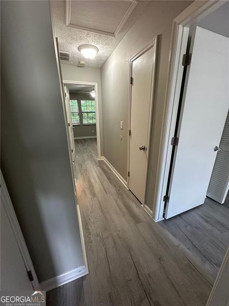 5388 Robertson Path, Lithonia, GA 30038 - hallway featuring wood finished floors and baseboards