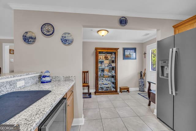 26-105 Midway Street Unit #108But Door #105, Helen, GA 30545 - kitchen featuring stainless steel refrigerator with ice dispenser, baseboards, crown molding, light tile patterned floors, and light stone countertops