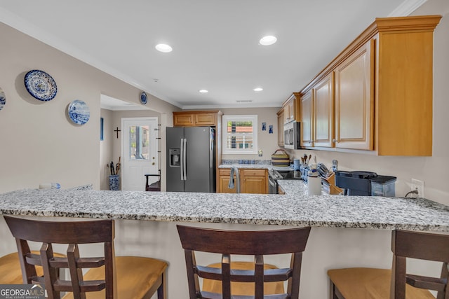 26-105 Midway Street Unit #108But Door #105, Helen, GA 30545 - kitchen with stainless steel appliances, a peninsula, light stone counters, ornamental molding, and recessed lighting