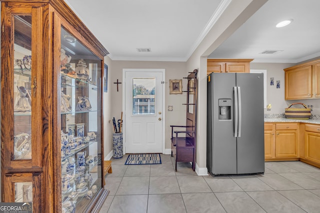 26-105 Midway Street Unit #108But Door #105, Helen, GA 30545 - kitchen featuring stainless steel refrigerator with ice dispenser, light tile patterned floors, ornamental molding, baseboards, and light brown cabinetry