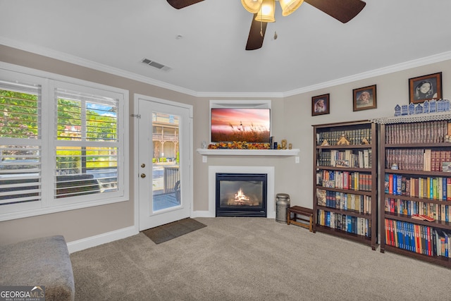 26-105 Midway Street Unit #108But Door #105, Helen, GA 30545 - carpeted living area featuring a ceiling fan, ornamental molding, a glass covered fireplace, and baseboards