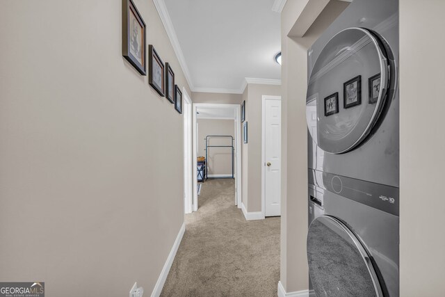 26-105 Midway Street Unit #108But Door #105, Helen, GA 30545 - laundry room with estacked washer and dryer, carpet, baseboards, and crown molding