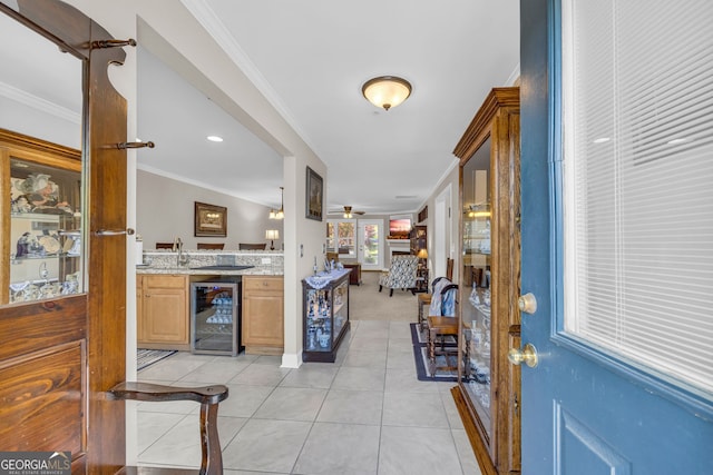 26-105 Midway Street Unit #108But Door #105, Helen, GA 30545 - foyer featuring wine cooler, wet bar, crown molding, light tile patterned flooring, and ceiling fan
