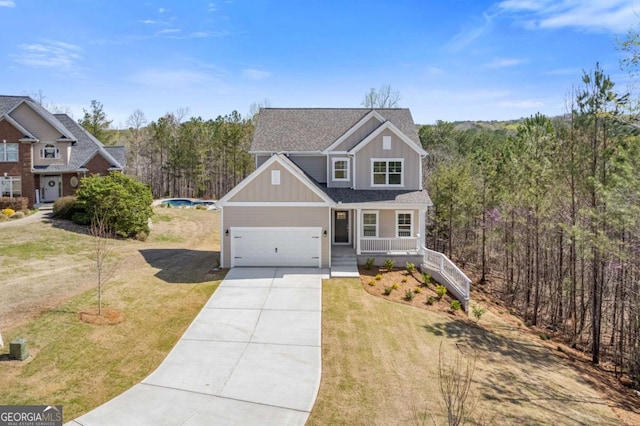 688 Shoals Trl, Dallas, GA 30132 - view of front of property featuring driveway, a porch, board and batten siding, a front yard, and a shingled roof