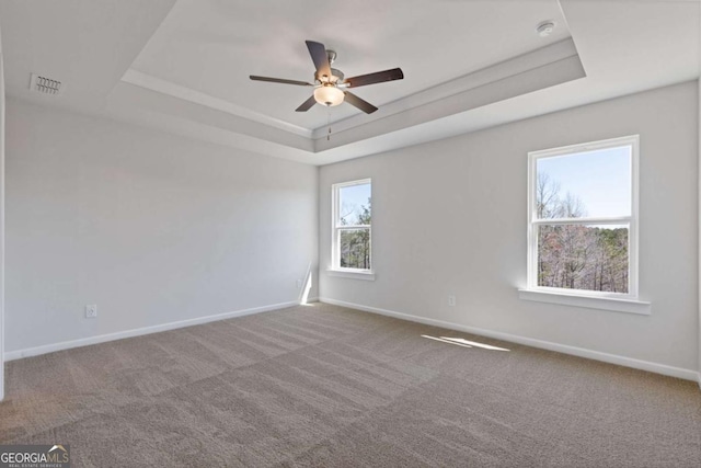 688 Shoals Trl, Dallas, GA 30132 - carpeted spare room featuring a tray ceiling, baseboards, and a ceiling fan