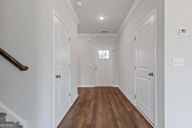 688 Shoals Trl, Dallas, GA 30132 - doorway featuring crown molding, dark wood-style floors, baseboards, and stairway