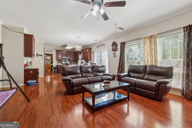 1093 Forest View Ln SW, Lilburn, GA 30047 - living area featuring a ceiling fan, crown molding, healthy amount of natural light, and dark wood-style flooring