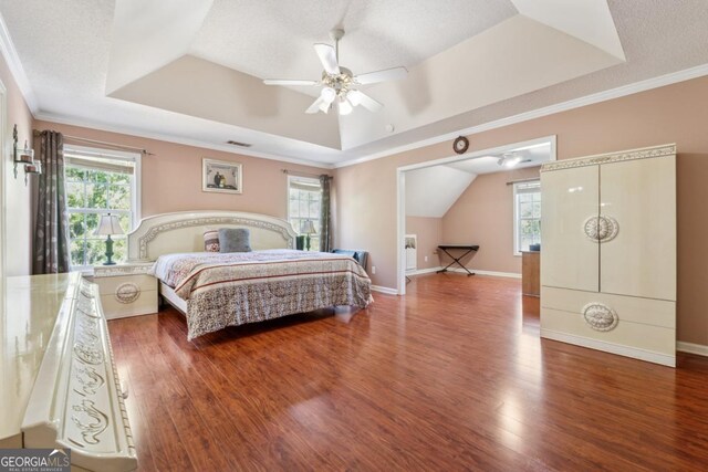 1093 Forest View Ln SW, Lilburn, GA 30047 - bedroom featuring a raised ceiling, wood finished floors, ornamental molding, and baseboards