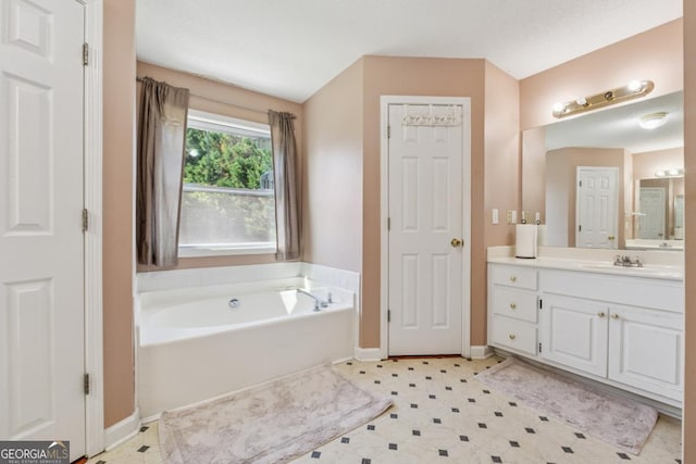 1093 Forest View Ln SW, Lilburn, GA 30047 - bathroom with vanity, a garden tub, baseboards, and tile patterned floors