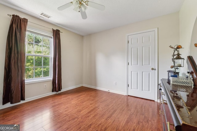 1093 Forest View Ln SW, Lilburn, GA 30047 - unfurnished bedroom with multiple windows, wood finished floors, and baseboards