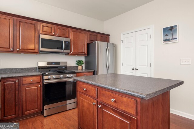 1379 Thornborough Dr, Alpharetta, GA 30004 - kitchen featuring stainless steel appliances, a sink, and dark countertops