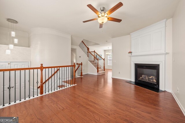 1379 Thornborough Dr, Alpharetta, GA 30004 - kitchen featuring appliances with stainless steel finishes, a sink, dark countertops, a center island, and wood finished floors