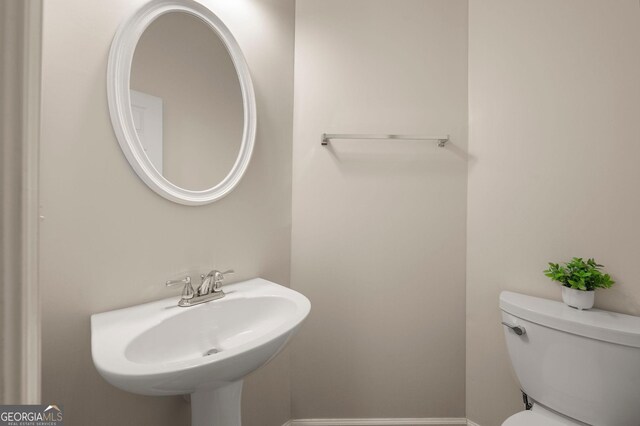 1379 Thornborough Dr, Alpharetta, GA 30004 - corridor with wood finished floors, baseboards, and an upstairs landing