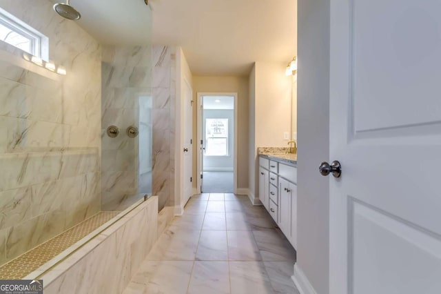 407 Shoals Trl, Dallas, GA 30132 - full bath with a marble finish shower, vanity, and healthy amount of natural light