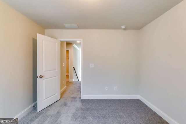 407 Shoals Trl, Dallas, GA 30132 - spare room featuring carpet flooring and baseboards