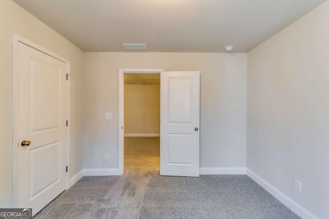 407 Shoals Trl, Dallas, GA 30132 - unfurnished bedroom with carpet floors and baseboards