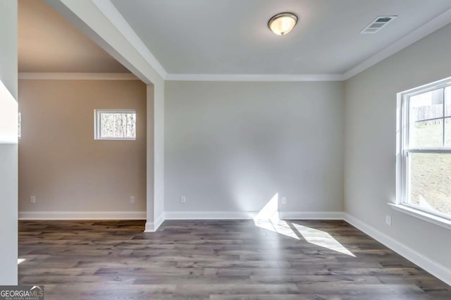 407 Shoals Trl, Dallas, GA 30132 - spare room featuring crown molding, wood finished floors, and baseboards