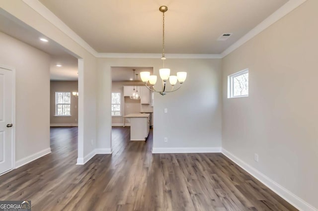 407 Shoals Trl, Dallas, GA 30132 - unfurnished dining area with a chandelier, crown molding, dark wood-style floors, baseboards, and recessed lighting