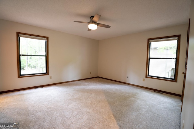 3966 N Indian Cir NW, Kennesaw, GA 30144 - spare room with light colored carpet and ceiling fan