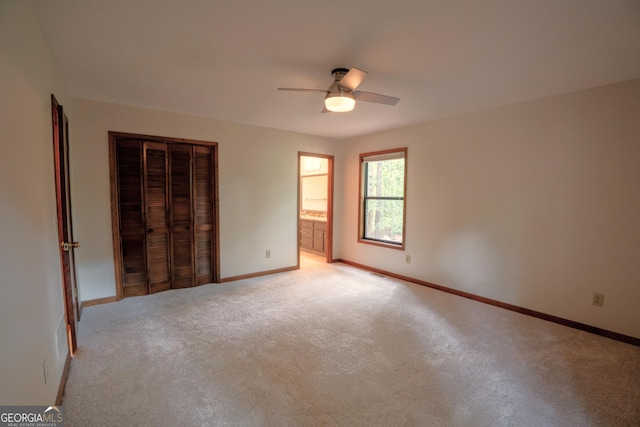 3966 N Indian Cir NW, Kennesaw, GA 30144 - unfurnished bedroom featuring light colored carpet, a closet, a ceiling fan, and ensuite bath