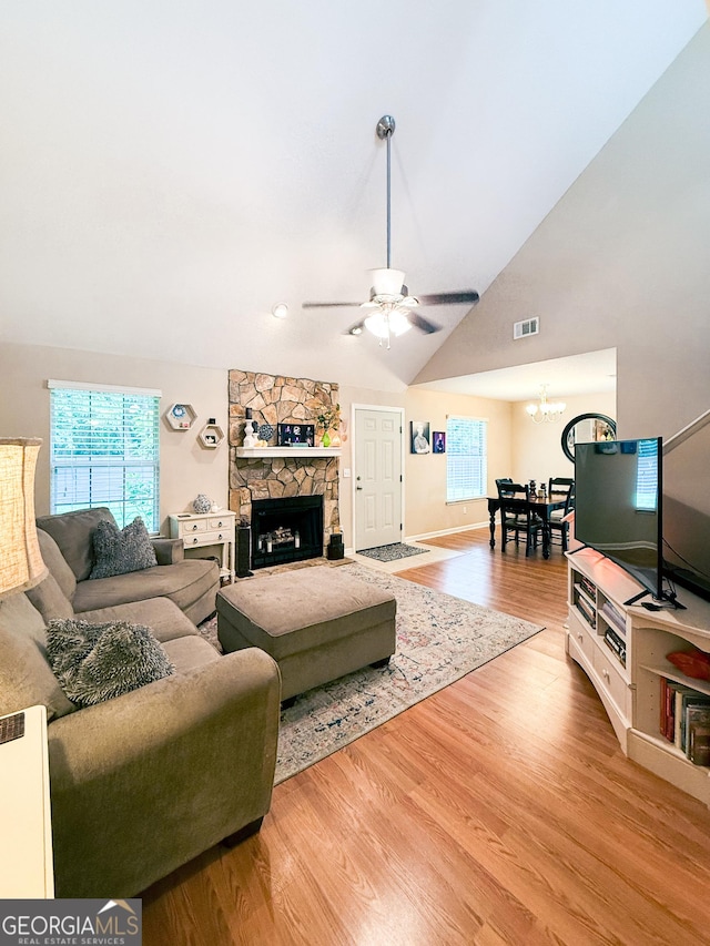 521 Lake Jordan Blvd W, Kingsland, GA 31548 - living area with lofted ceiling, a chandelier, wood finished floors, ceiling fan, and a fireplace
