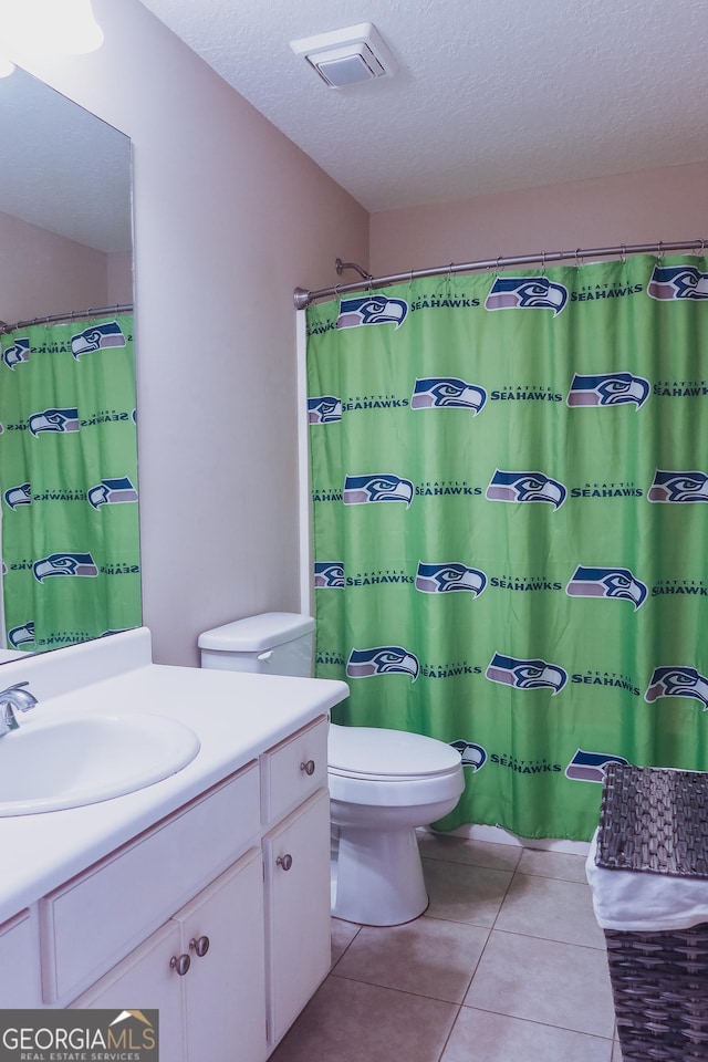 521 Lake Jordan Blvd W, Kingsland, GA 31548 - bathroom featuring vanity, a textured ceiling, and tile patterned flooring